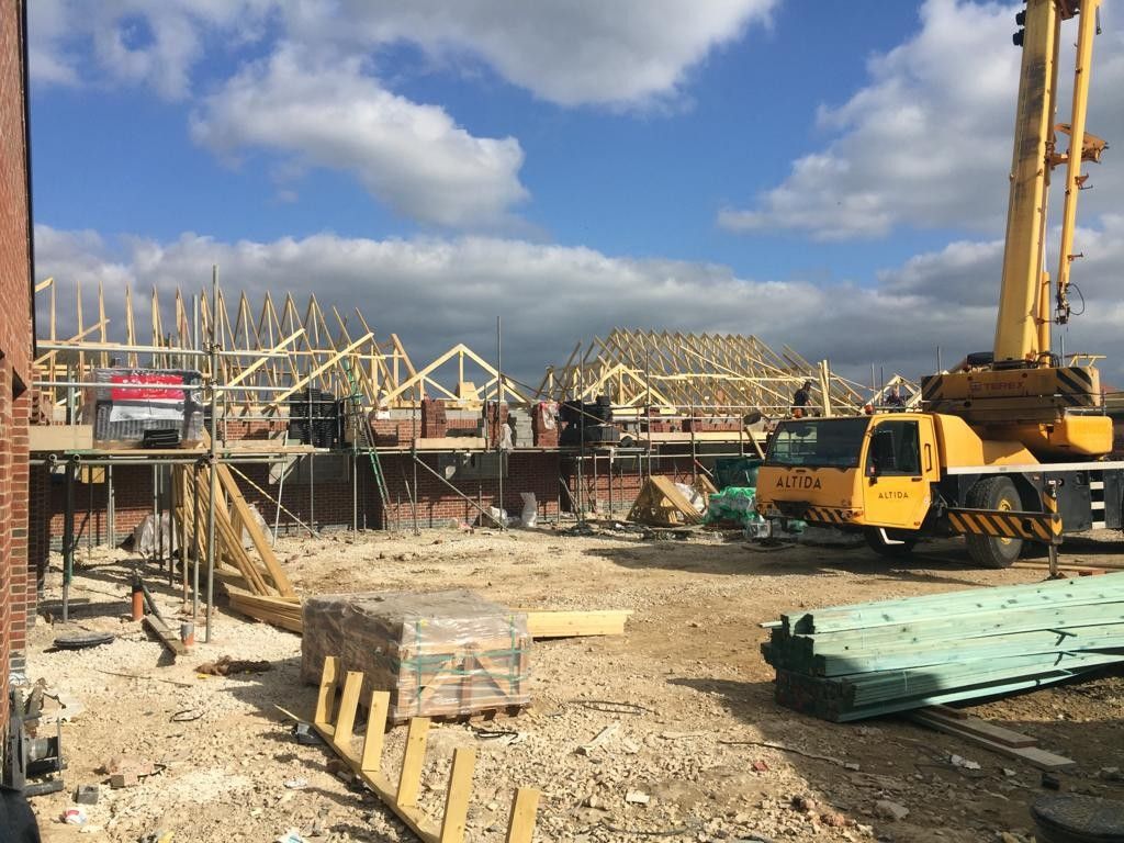 Roof trusses being craned into place
