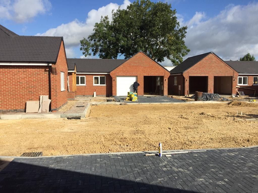 Bungalows roofed and weathertight, with garages built