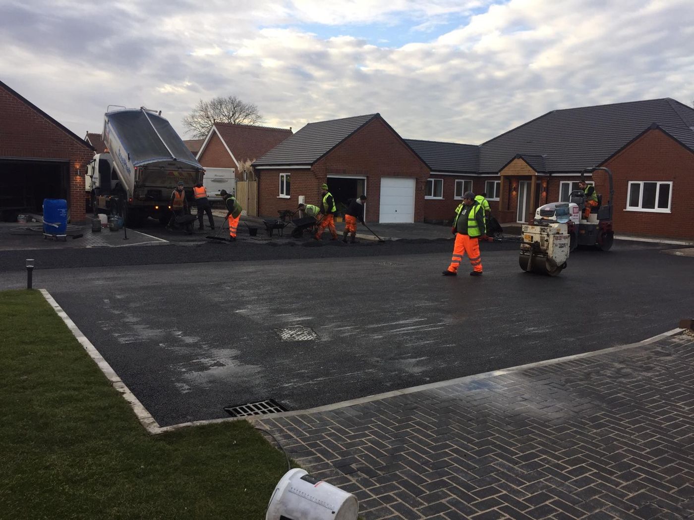 Shared drive being surfaced in front of the finished bungalows